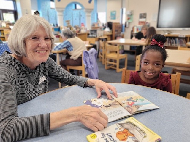Reading mentors from the National Council of Jewish Women read aloud with James A. Dever Elementary School students to sharpen their literacy skills.